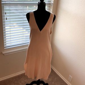 Creamy butter colored, belted & sleeveless dress with side slits